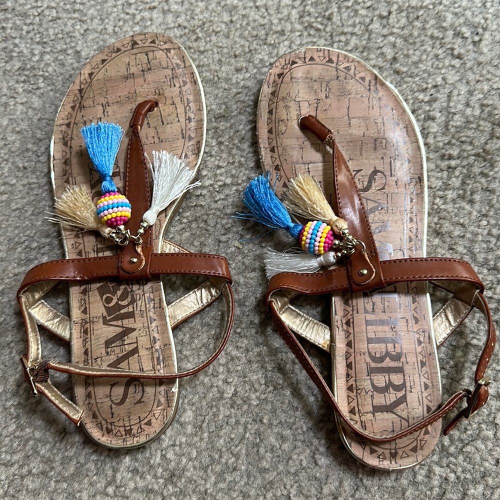 Very cute sandal with beads and fringe worn once!